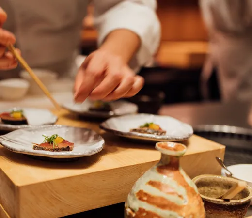 Chef plating a dish in the kitchen