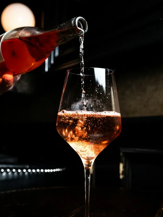 Wine being poured at a table